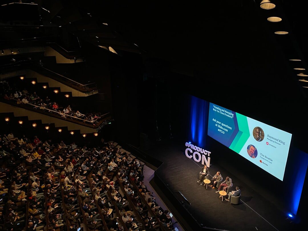 Tech summit business conference with speakers on stage