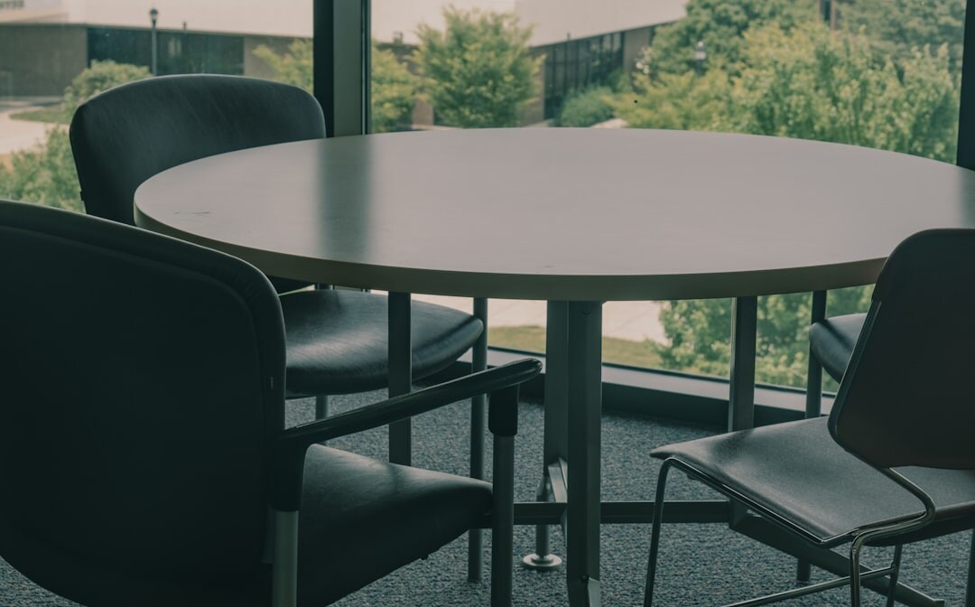 Corporate business forum with executives at round table